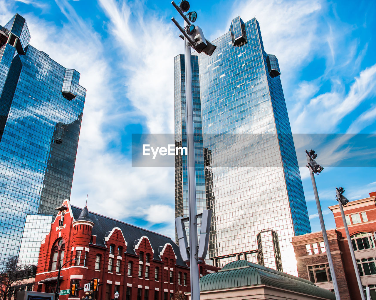 Low angle view of skyscraper in fort worth, texas with bright blue skies