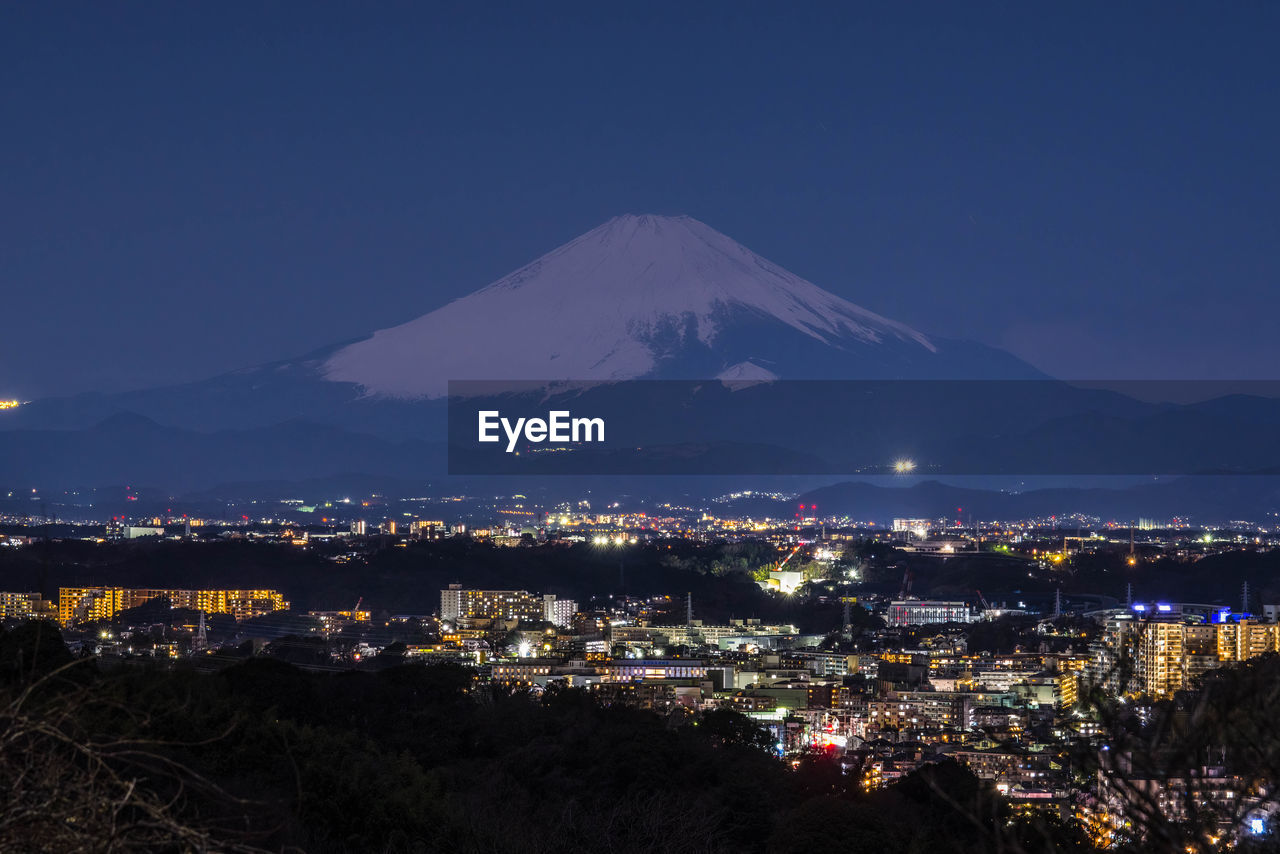 Fuji in the moonlight and the night view.