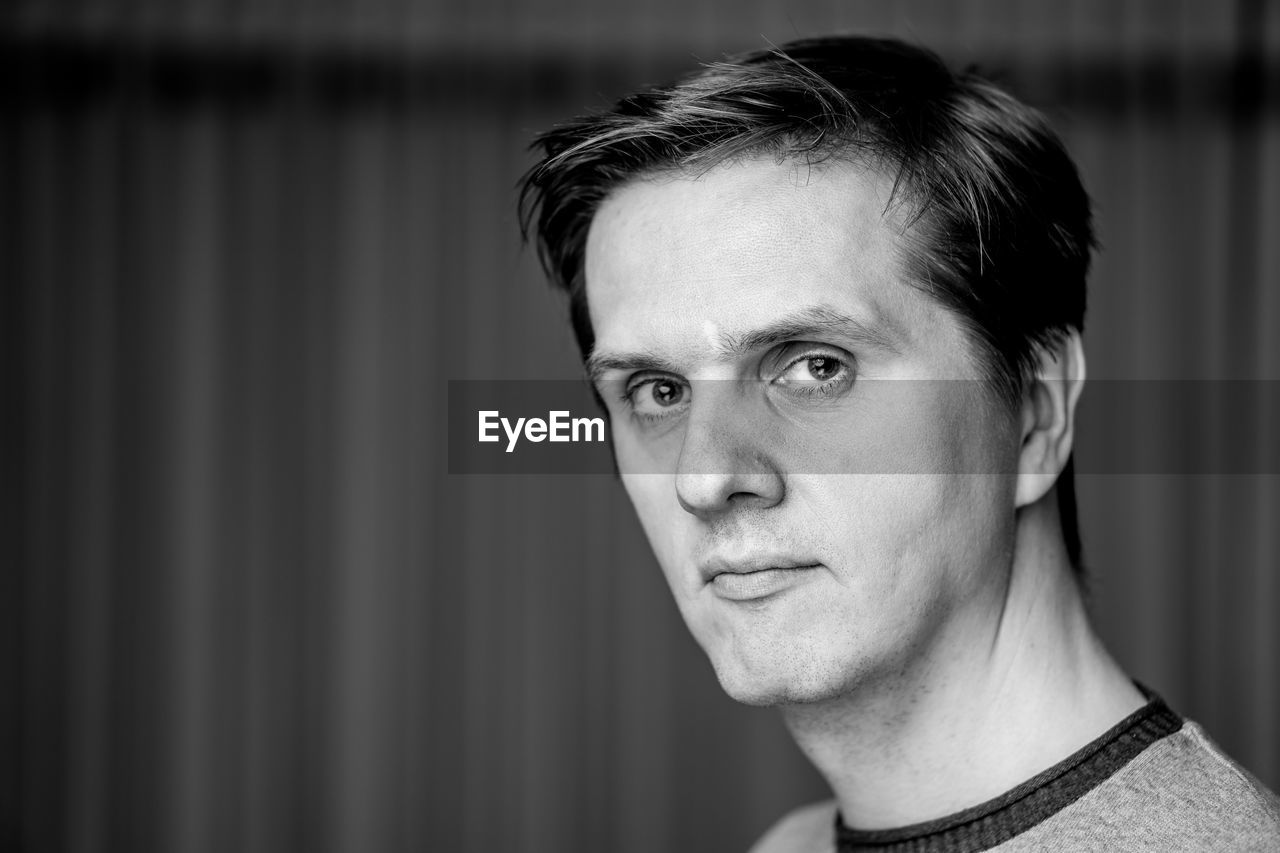 CLOSE-UP PORTRAIT OF YOUNG MAN WITH EYES CLOSED