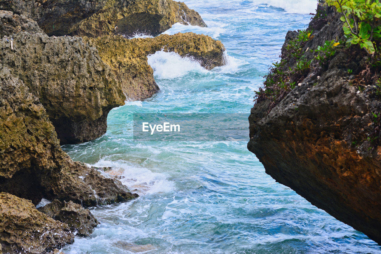 SCENIC VIEW OF SEA AND ROCKS