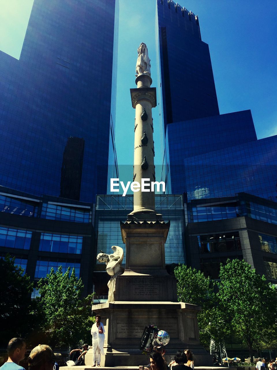 LOW ANGLE VIEW OF BUILDINGS AGAINST BLUE SKY