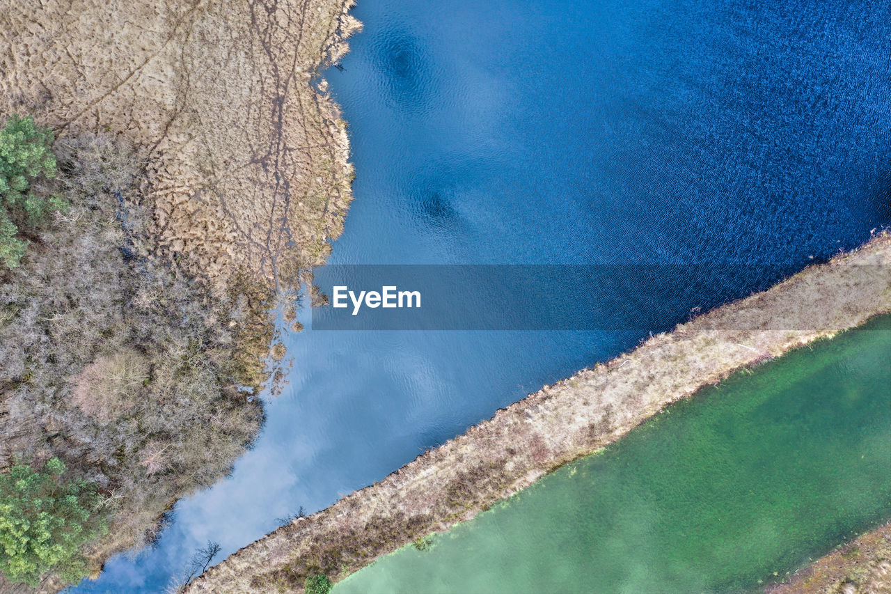 HIGH ANGLE VIEW OF SEA AND TREES