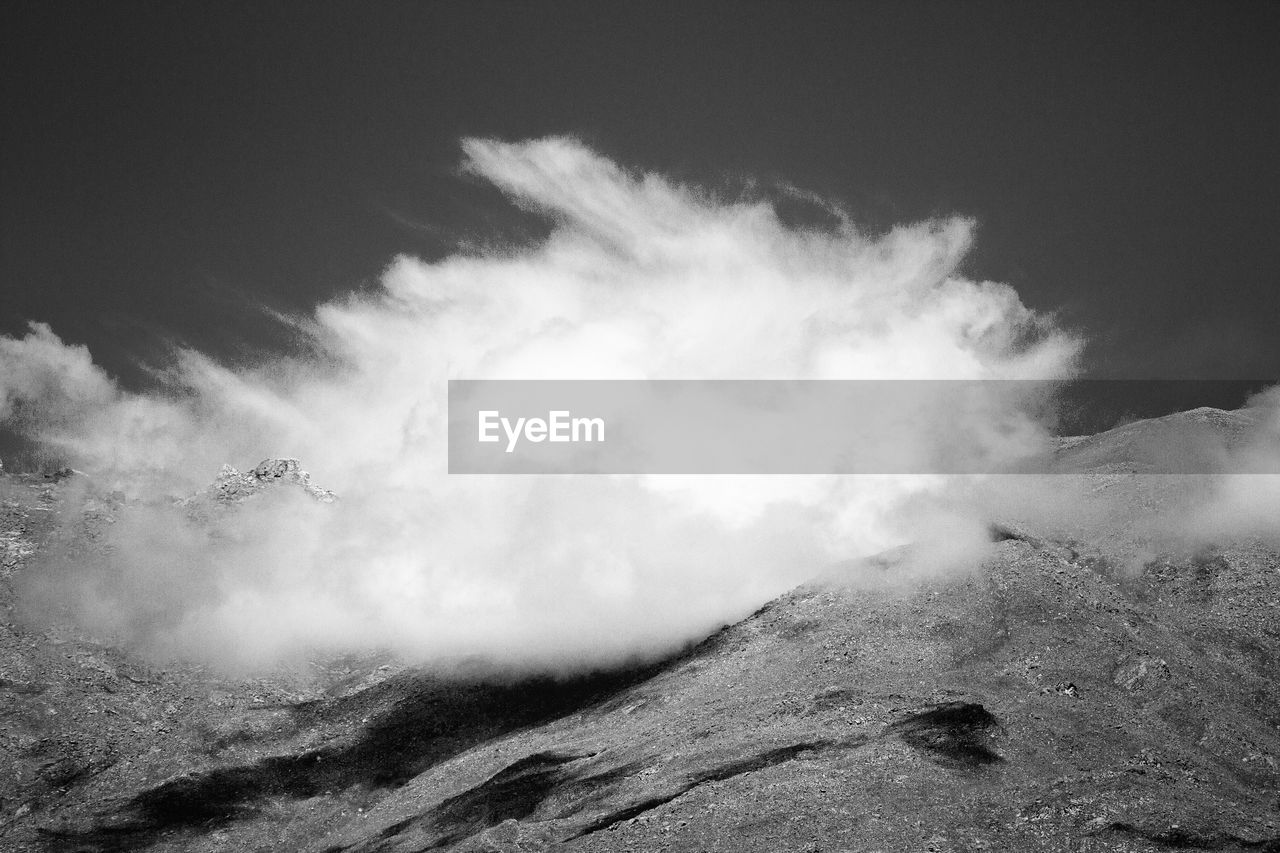 Scenic view of mountains in foggy weather