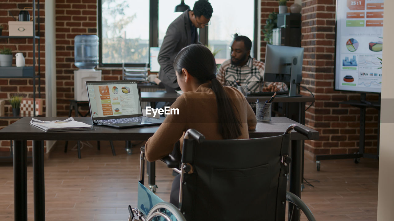 Disabled woman working in office