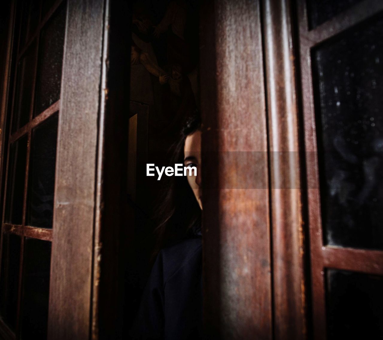Portrait of woman in window