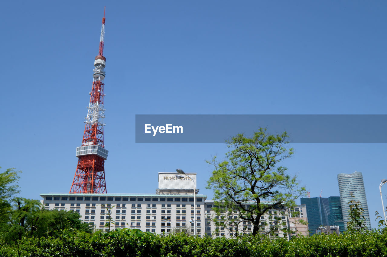 Low angle view of tokyo tower against clear sky in city