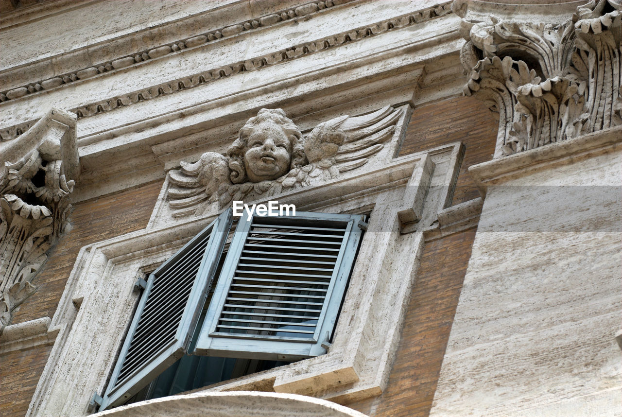 Low angle view of old statue at basilica di santa maria maggiore