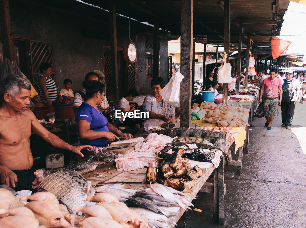 GROUP OF PEOPLE AT MARKET