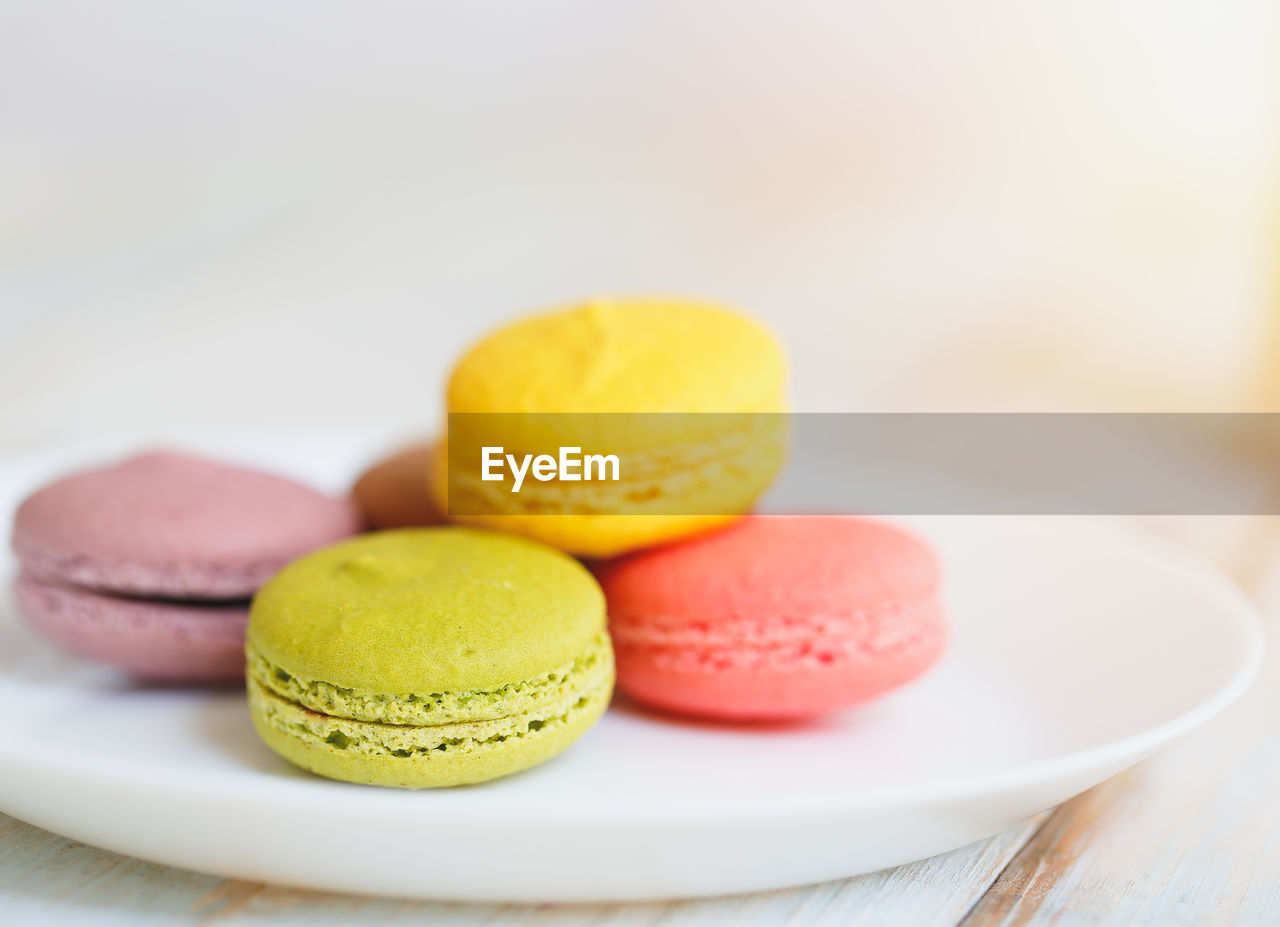 CLOSE-UP OF MULTI COLORED CANDIES ON TABLE