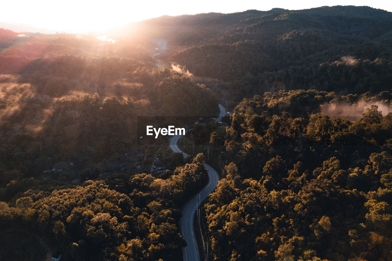 High angle view of trees against sky during sunset