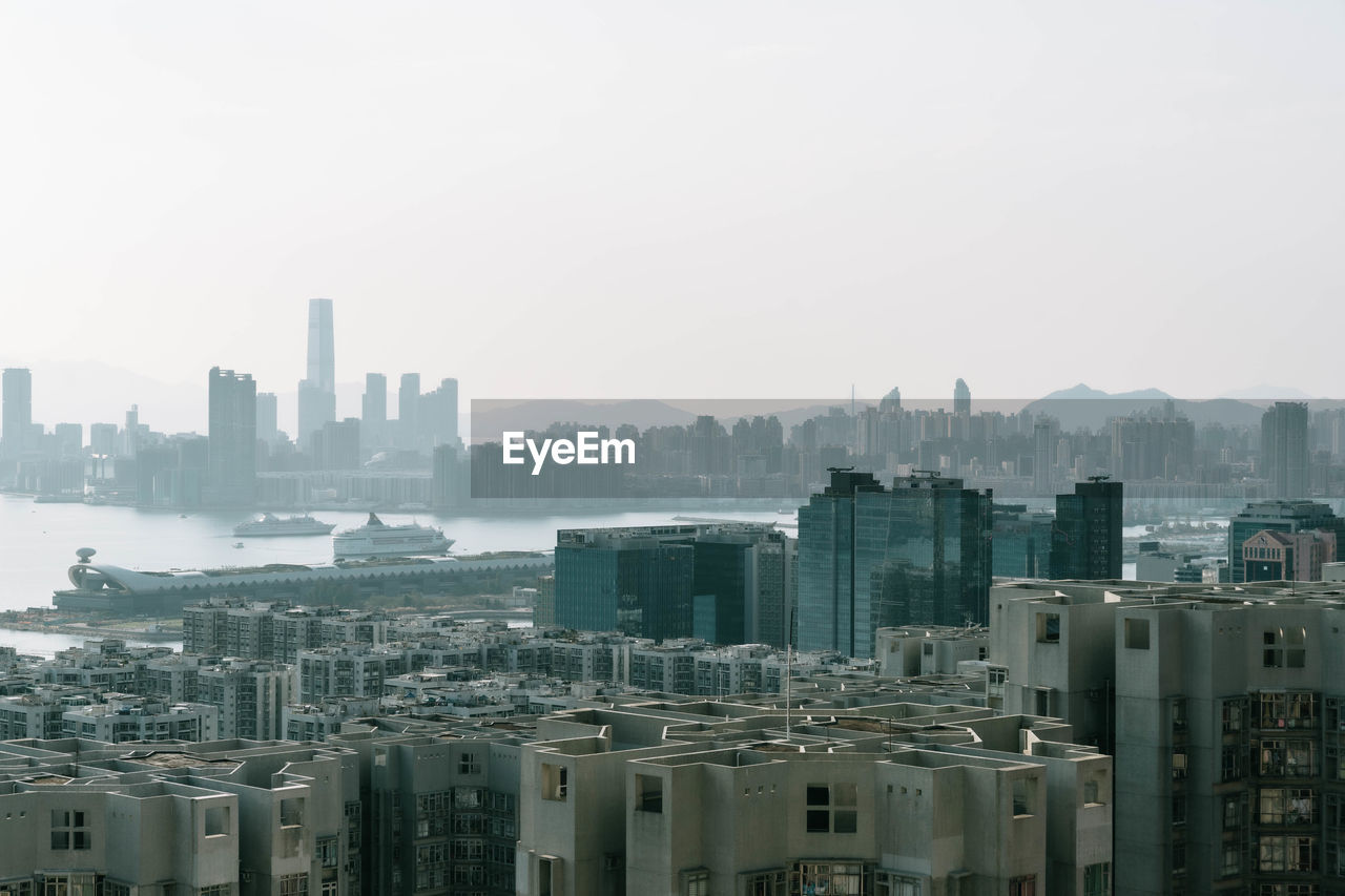 Modern buildings in city against clear sky