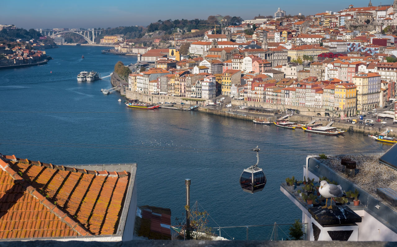 High angle view of townscape by sea