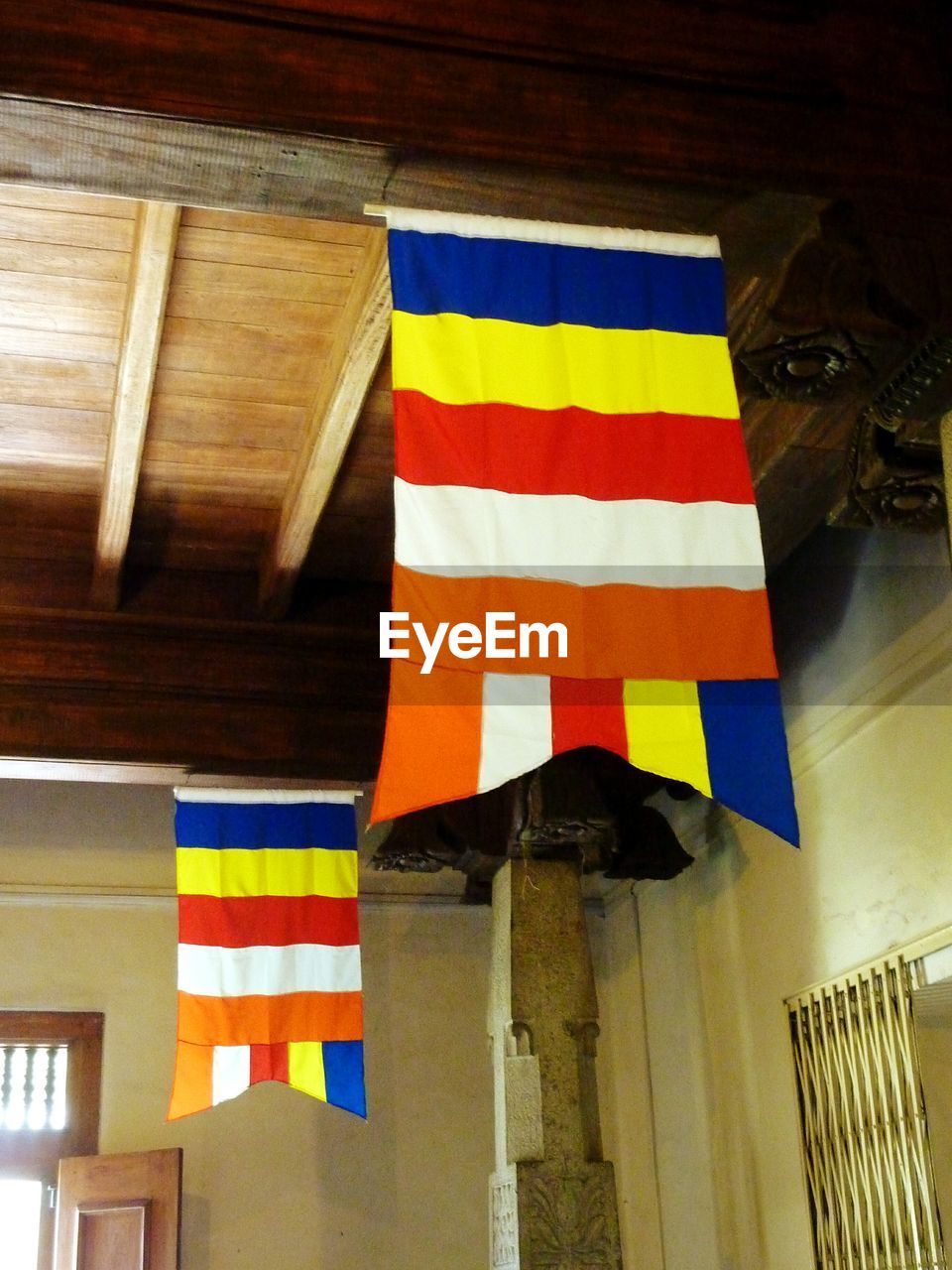 MULTI COLORED FLAG ON WALL