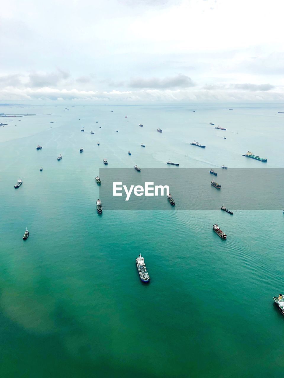 High angle view of sailboats in sea against sky