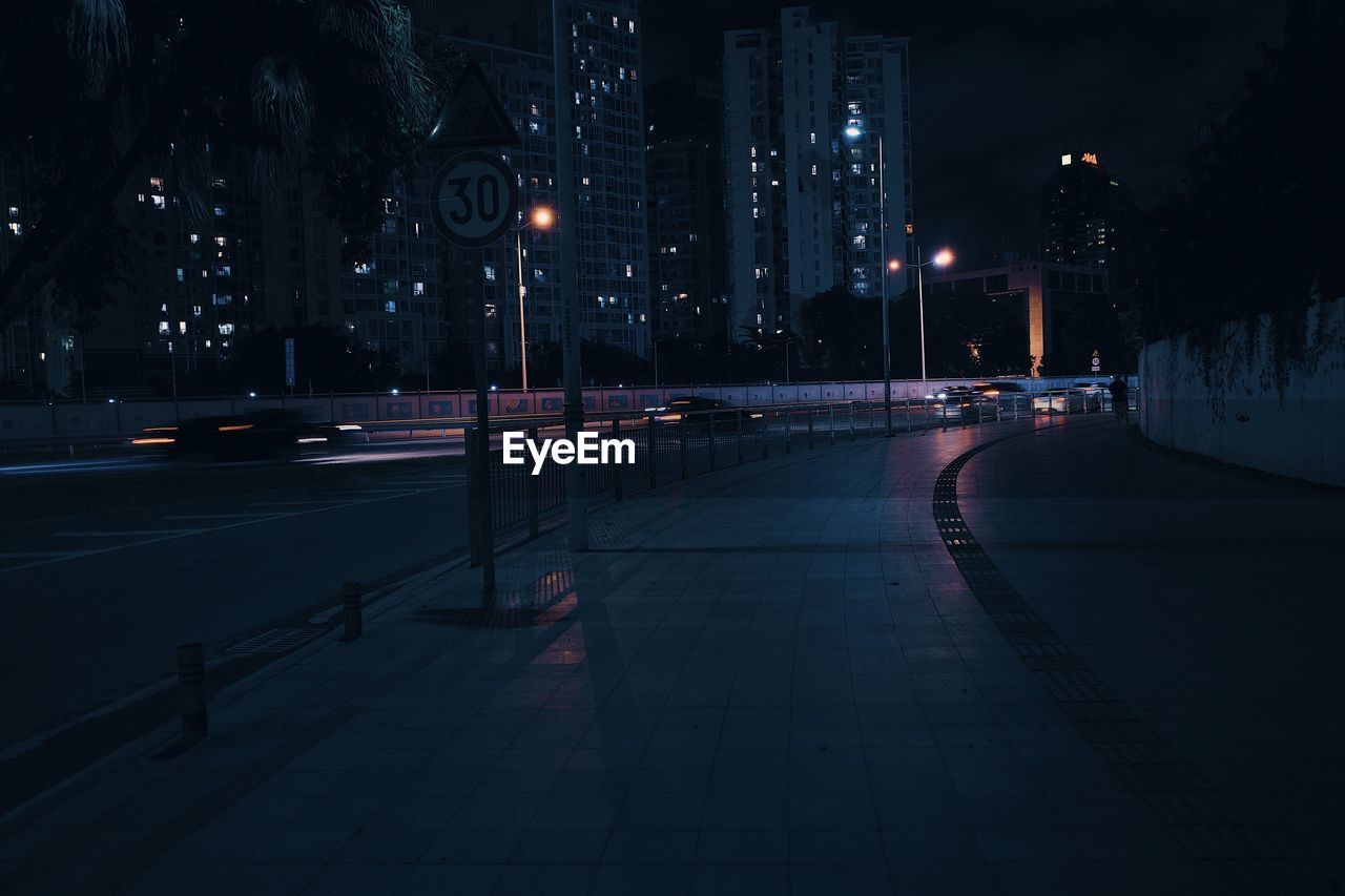 ILLUMINATED STREET LIGHTS AT NIGHT