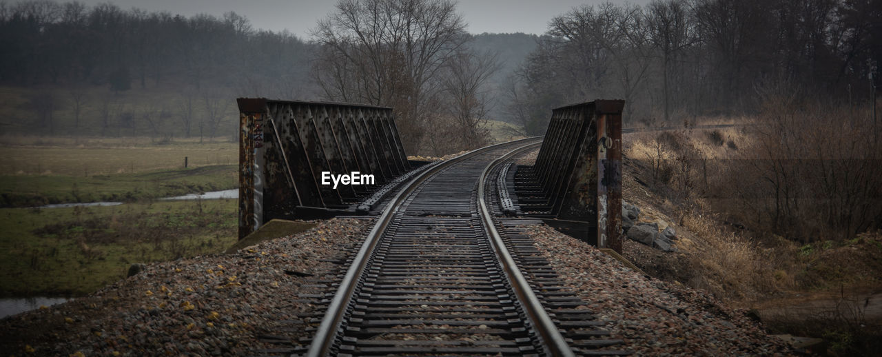 Railroad tracks in foggy weather