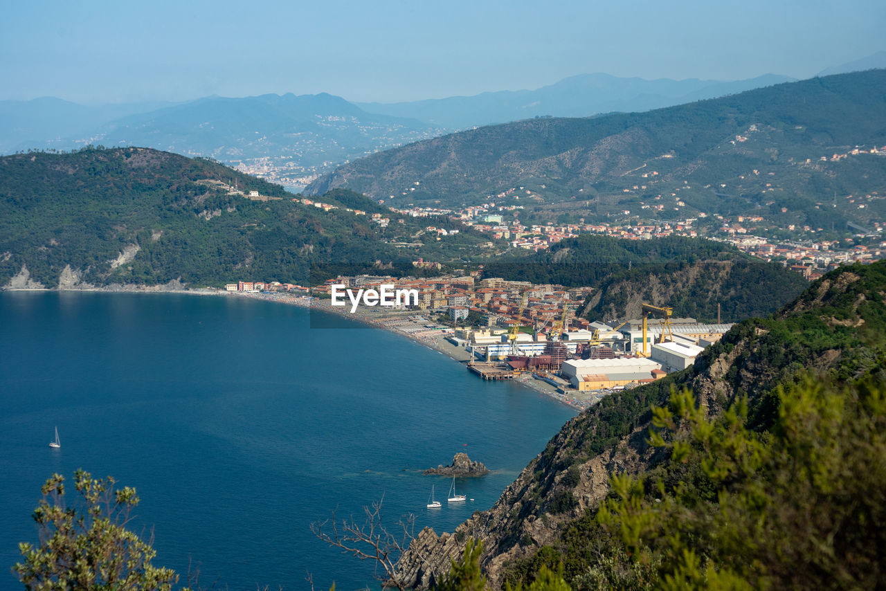 High angle view of townscape by sea