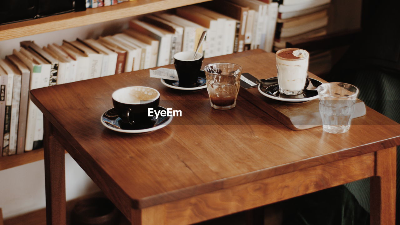 High angle view of coffee cups on table