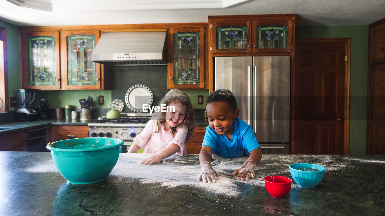 Kids making a mess in the kitchen