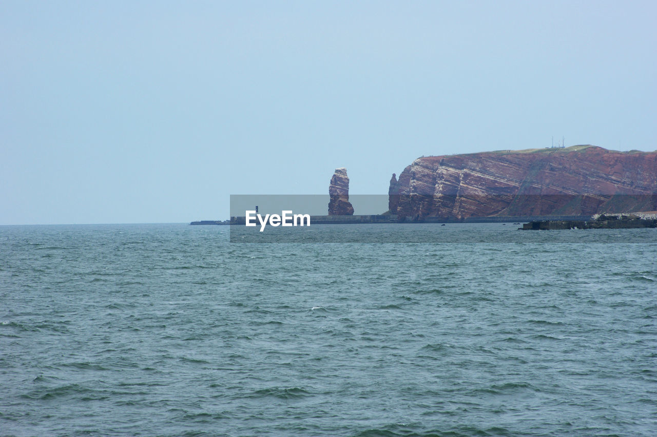 SCENIC VIEW OF BLUE SEA AGAINST CLEAR SKY