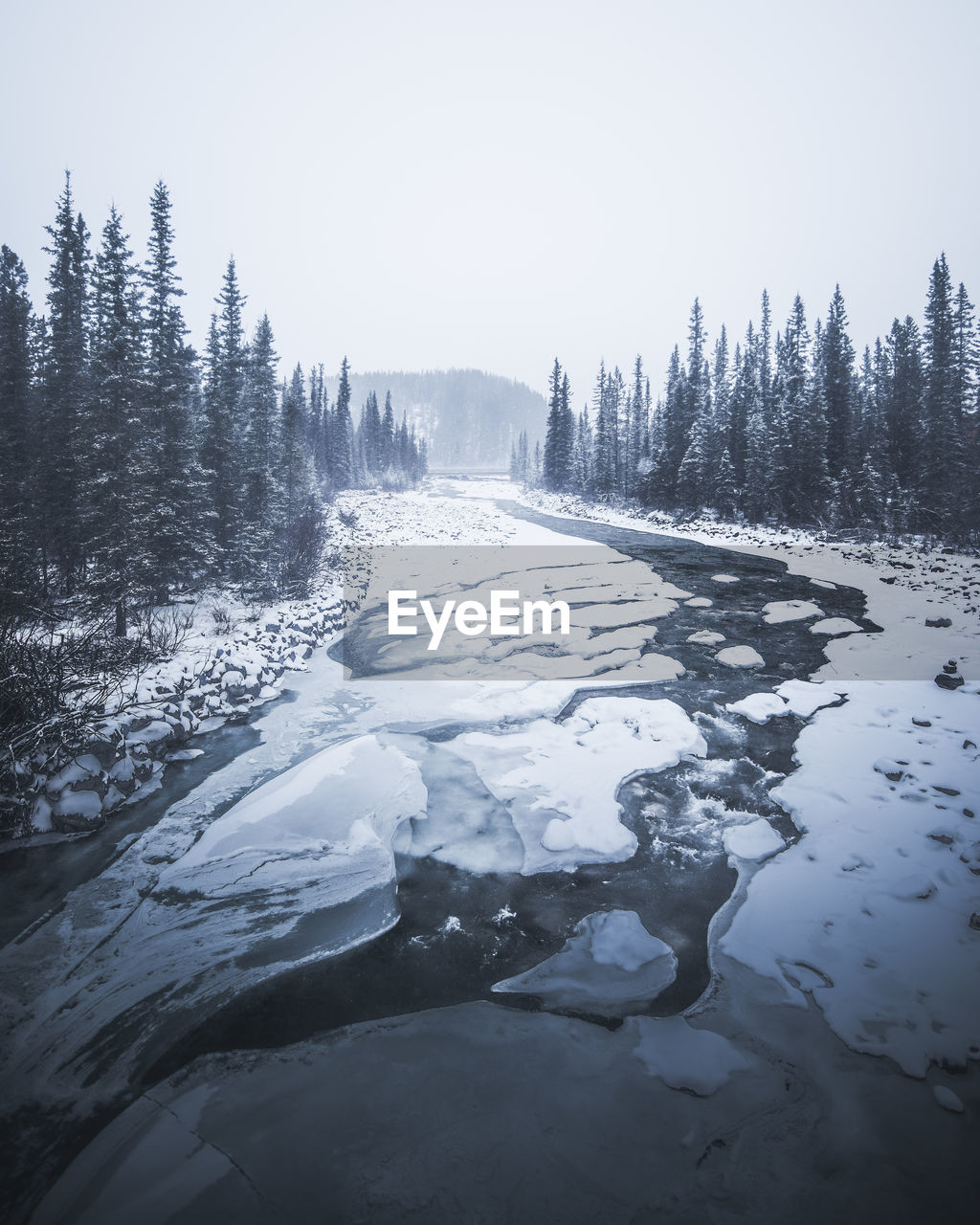 Scenic view of frozen lake against clear sky during winter