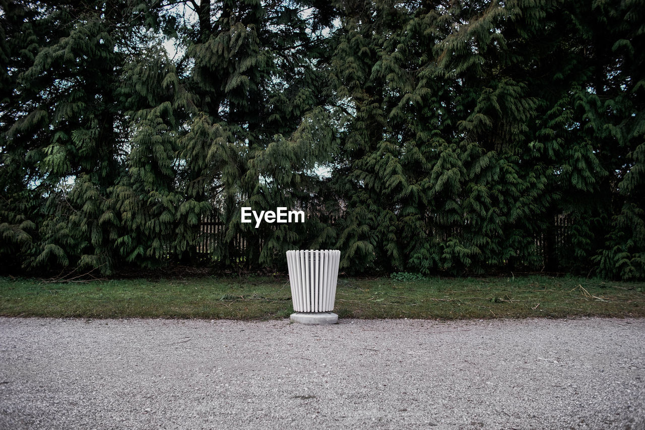 Trash can beside footpath