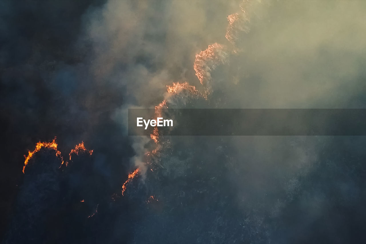 LOW ANGLE VIEW OF FIREWORK AGAINST SKY DURING AUTUMN