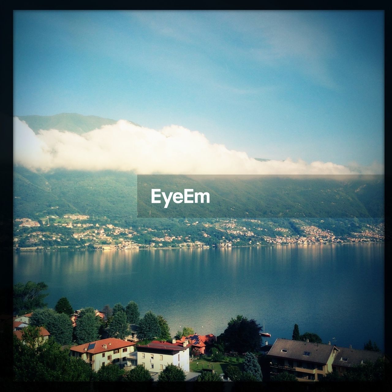 High angle view of lake in front of mountains against sky