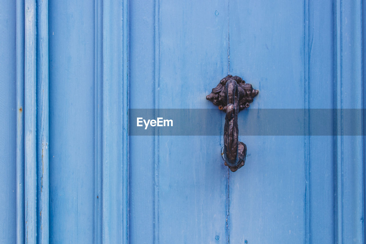 Closed blue wooden door