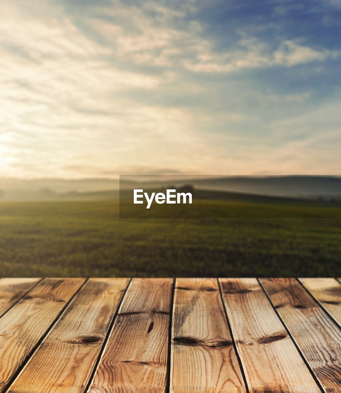 Scenic view of field against sky during sunset