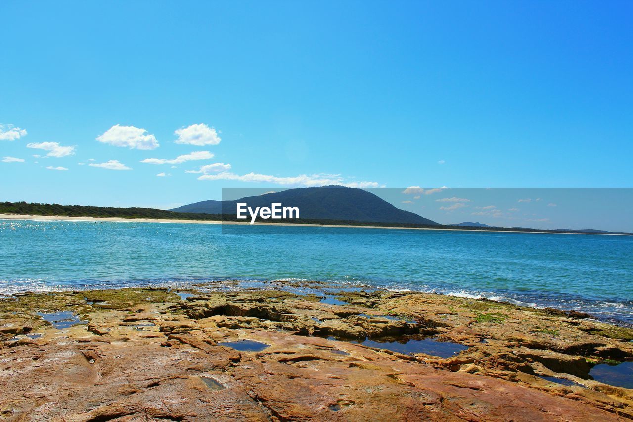 View of calm blue sea against sky