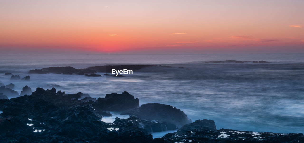 SCENIC VIEW OF SEA DURING SUNSET