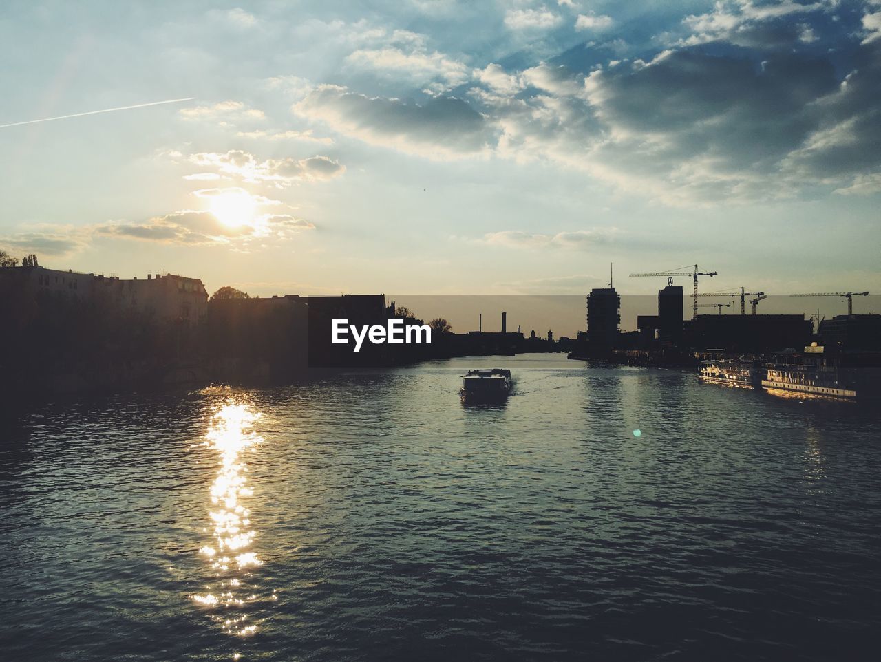 Scenic view of river at sunset