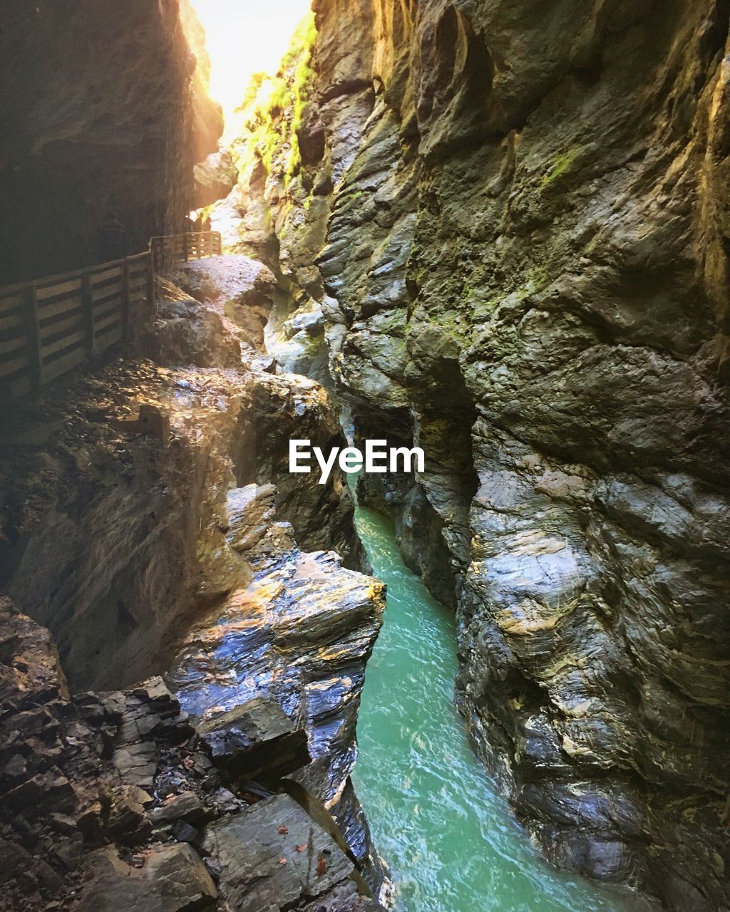 STREAM FLOWING THROUGH ROCKS