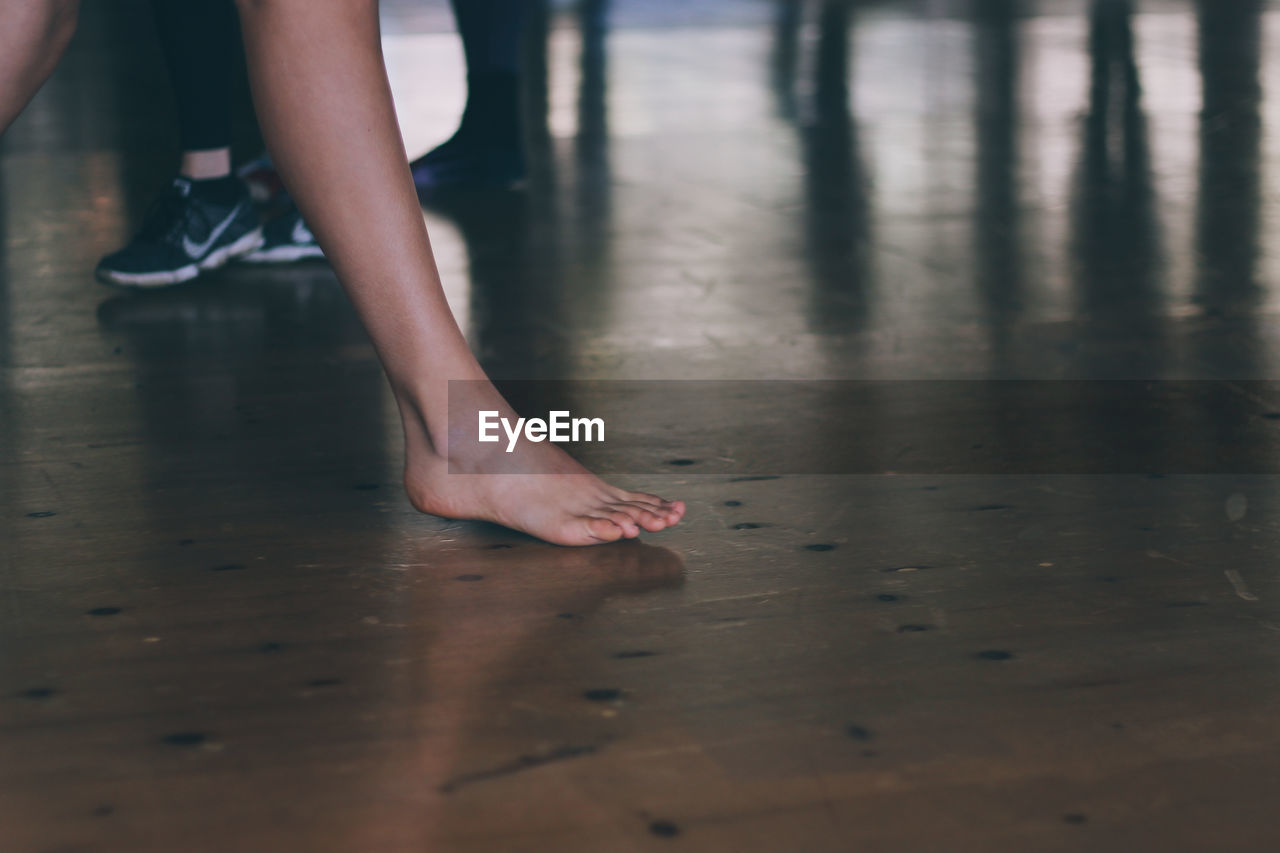 Low section of ballet dancer practicing in studio