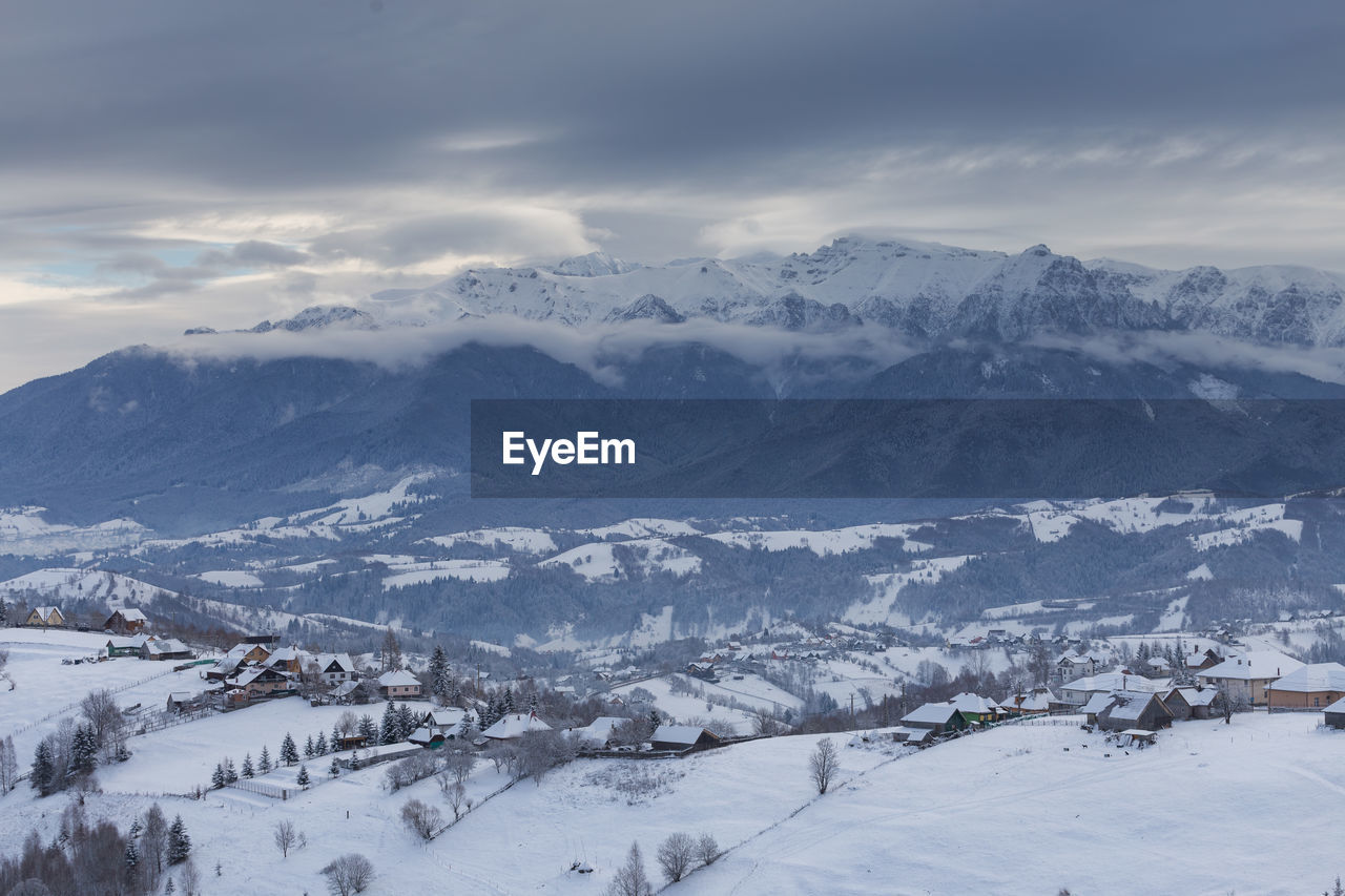 Scenic view of snowcapped mountains against sky