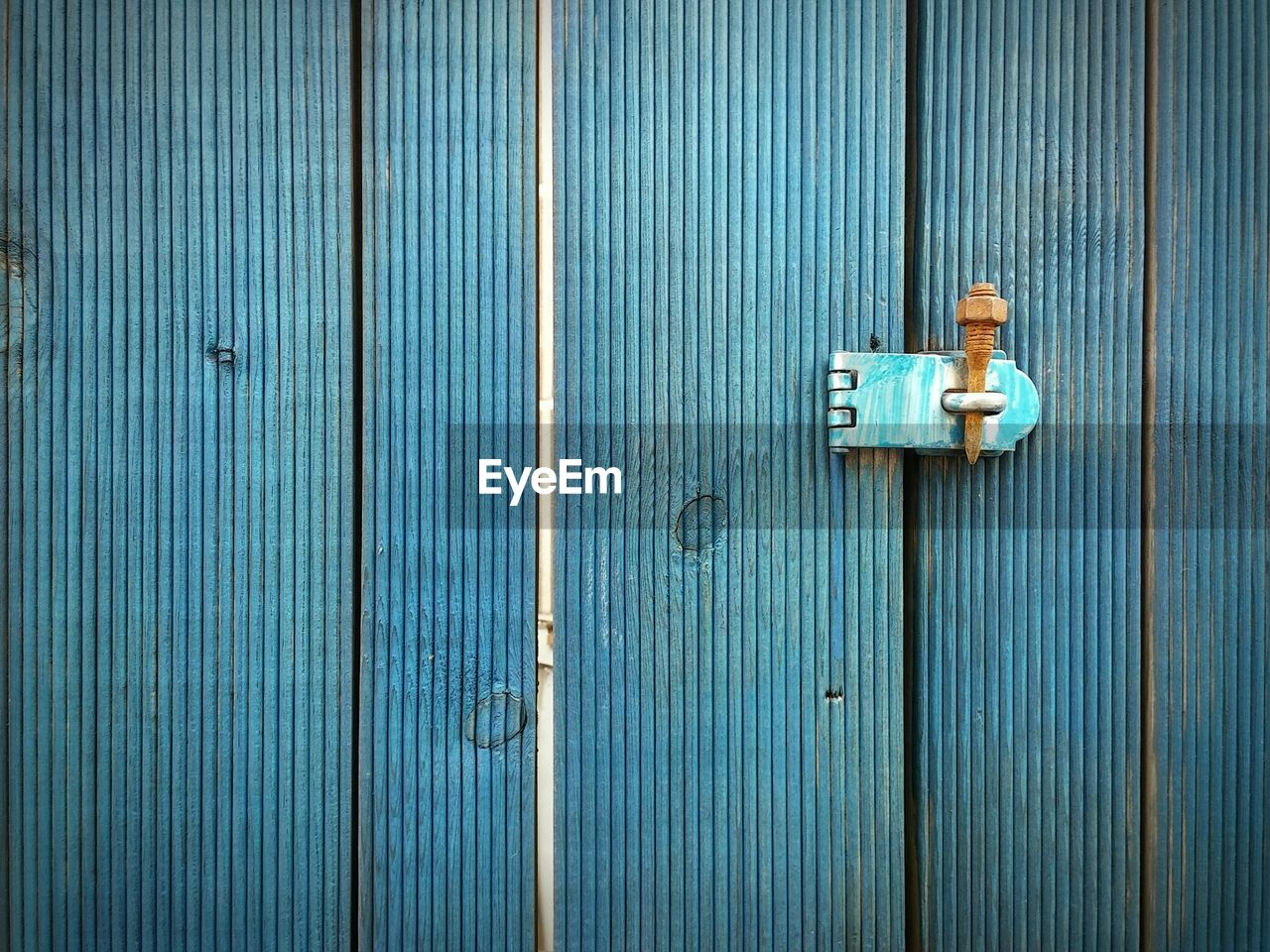 Full frame of blue wooden door