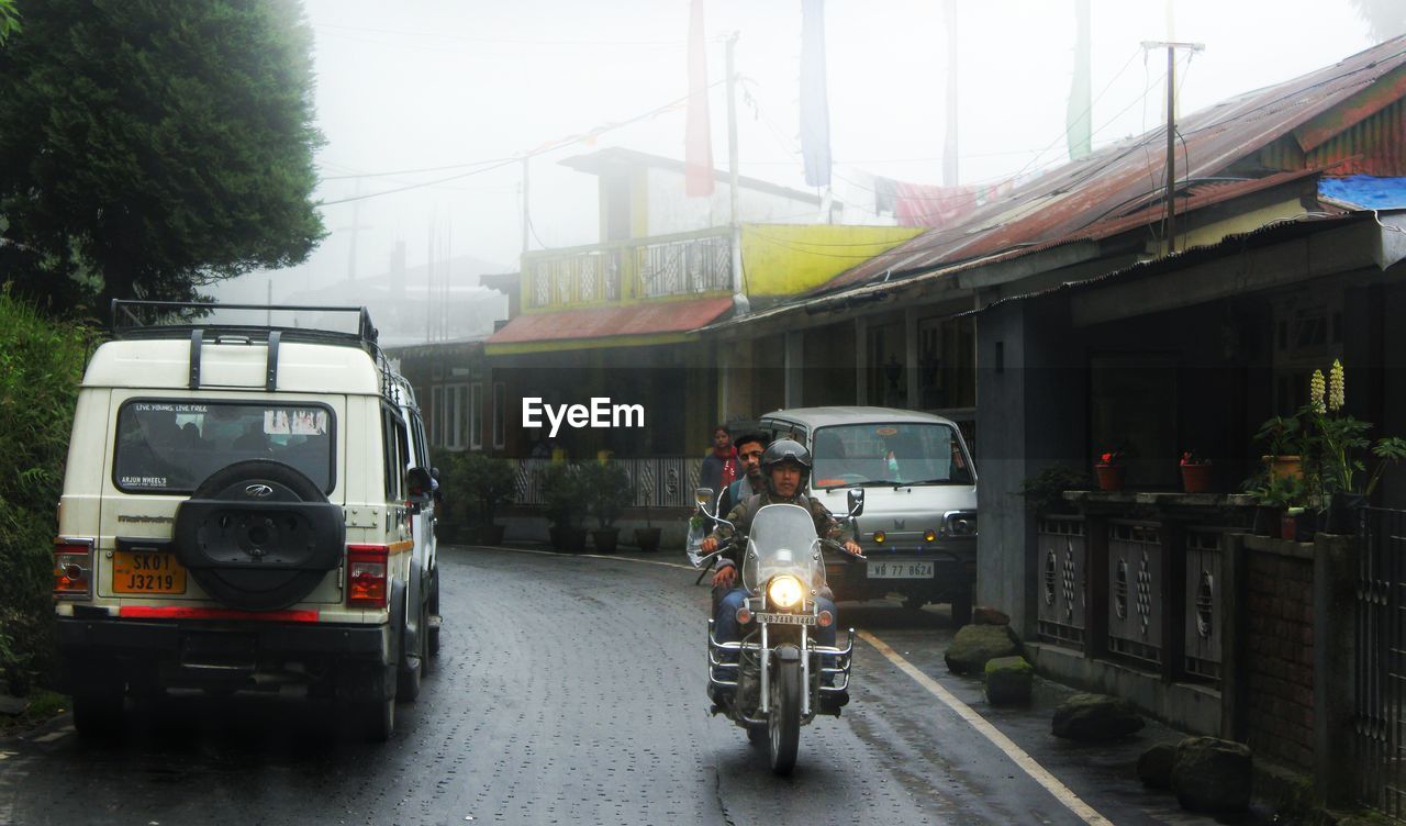 CARS ON ROAD IN RAIN