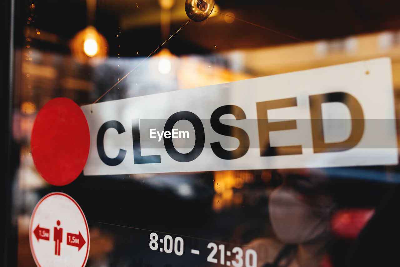 Signboard with closed text at the cafe through glass window. high quality photo