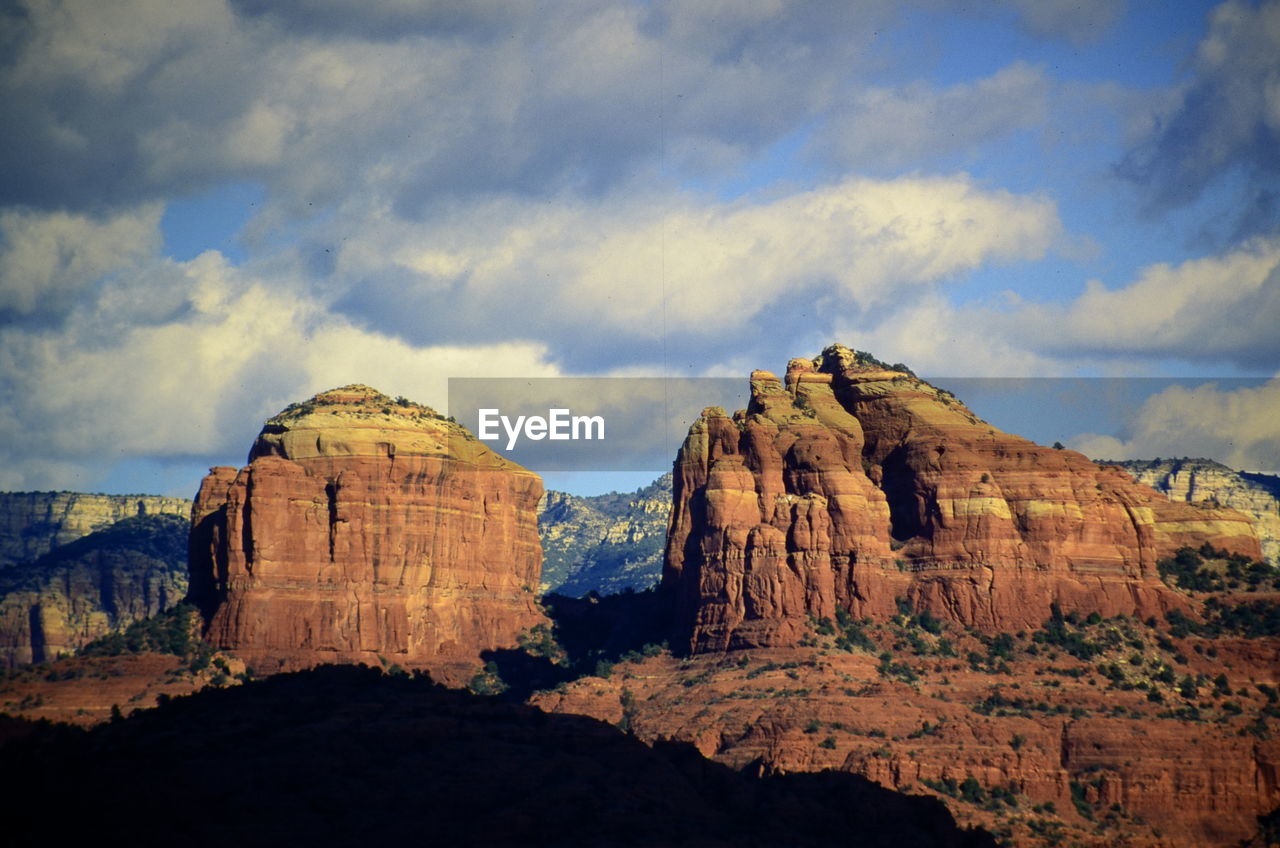 Panoramic view of rock formations against sky