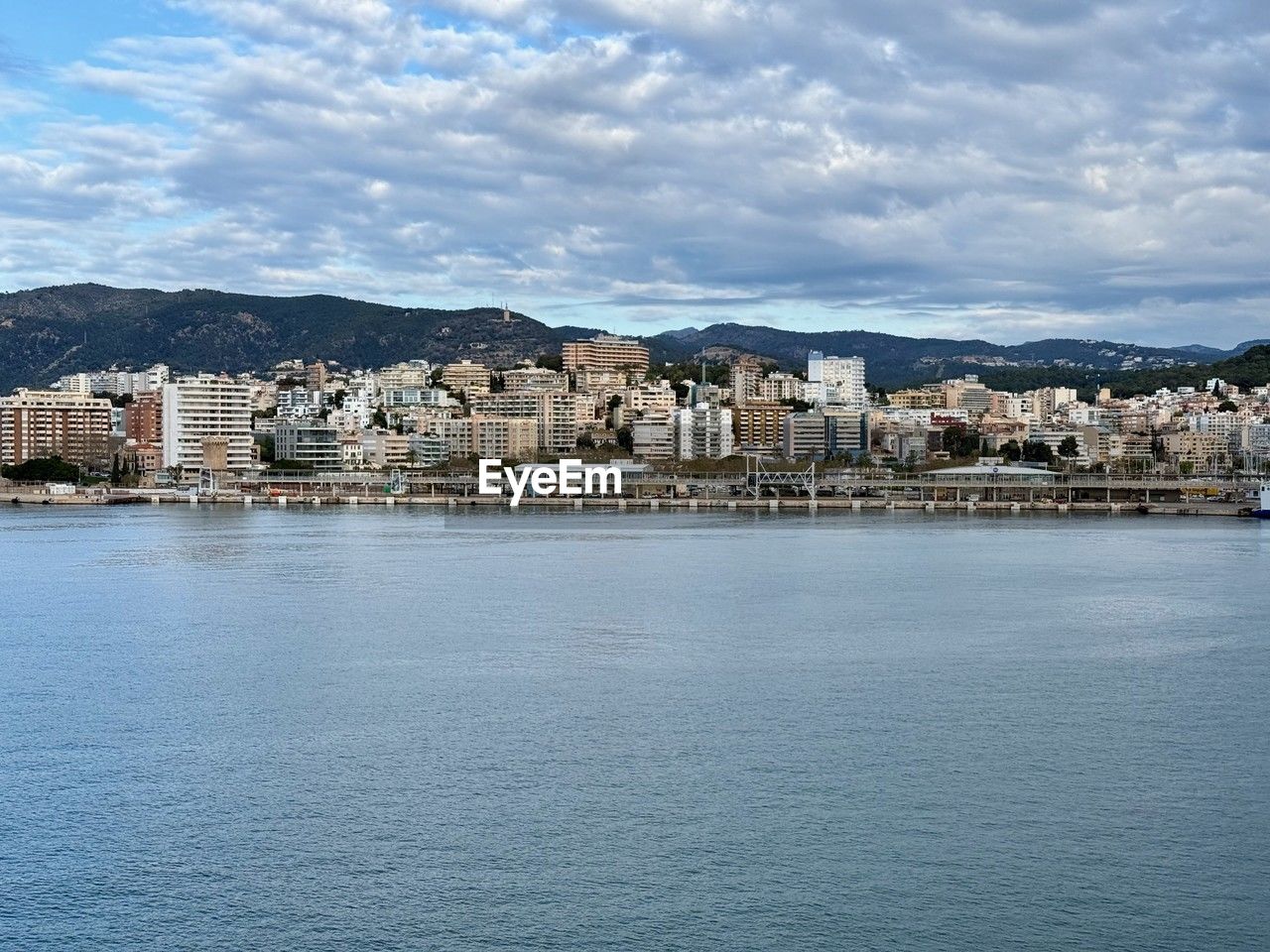 architecture, building exterior, built structure, city, water, building, sea, sky, coast, cityscape, travel destinations, nature, horizon, residential district, waterfront, no people, cloud, land, town, body of water, harbor, house, shore, mountain, bay, travel, skyline, beach, landscape, day, tourism, coastline, outdoors, city life, vacation, blue, environment, urban skyline, scenics - nature