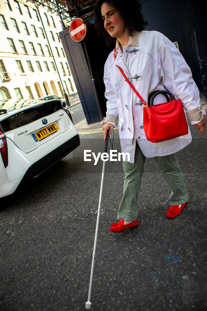 WOMAN STANDING ON STREET