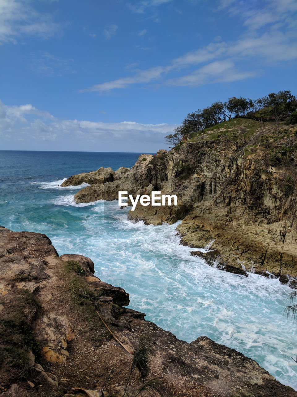 Scenic view of sea against blue sky