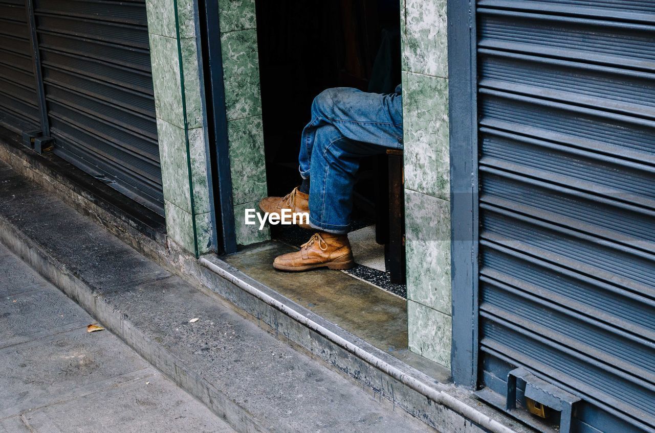 Man seen through closed door of window