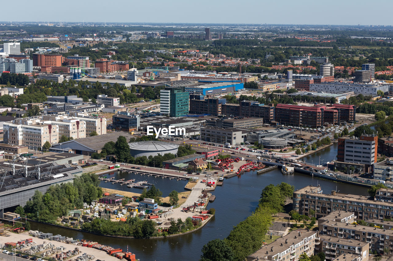 High angle view of river amidst buildings in city