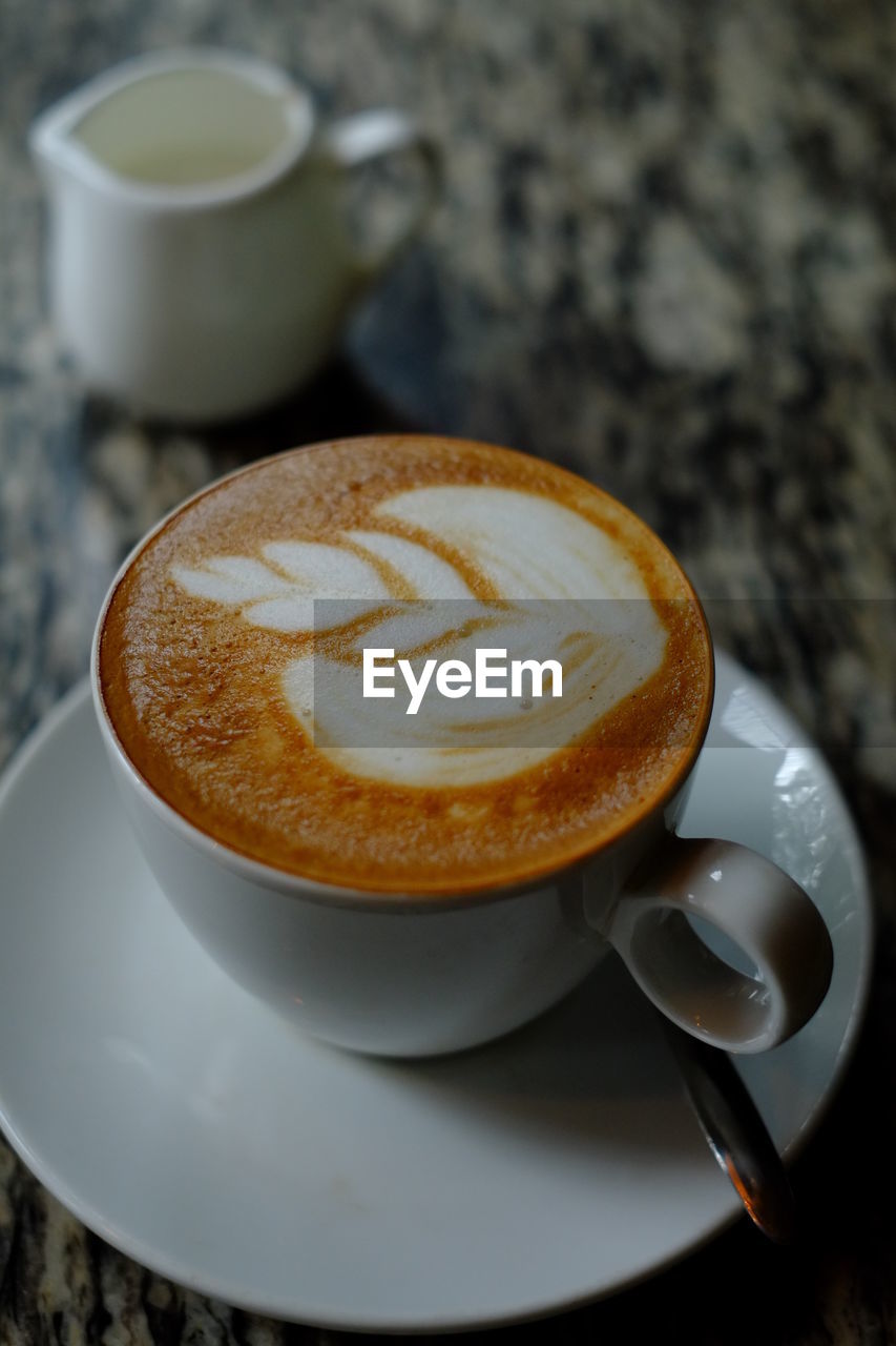 Close-up of coffee served on table