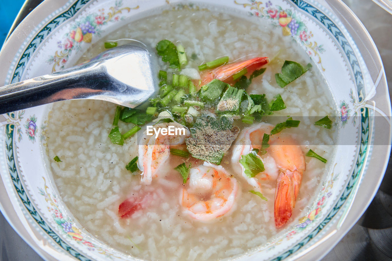 Close-up of prawn rice soup in bowl