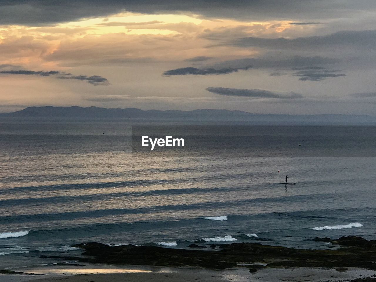 SCENIC VIEW OF SEA DURING SUNSET