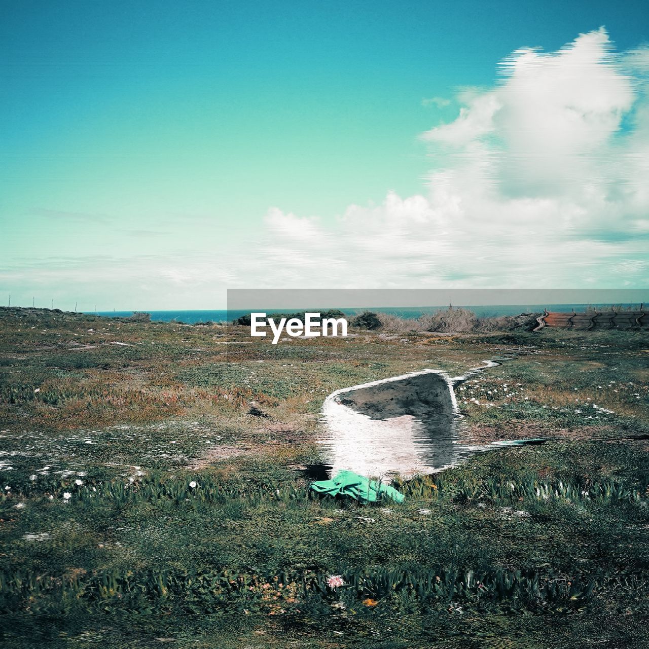 AERIAL VIEW OF ABANDONED LAND AGAINST SKY