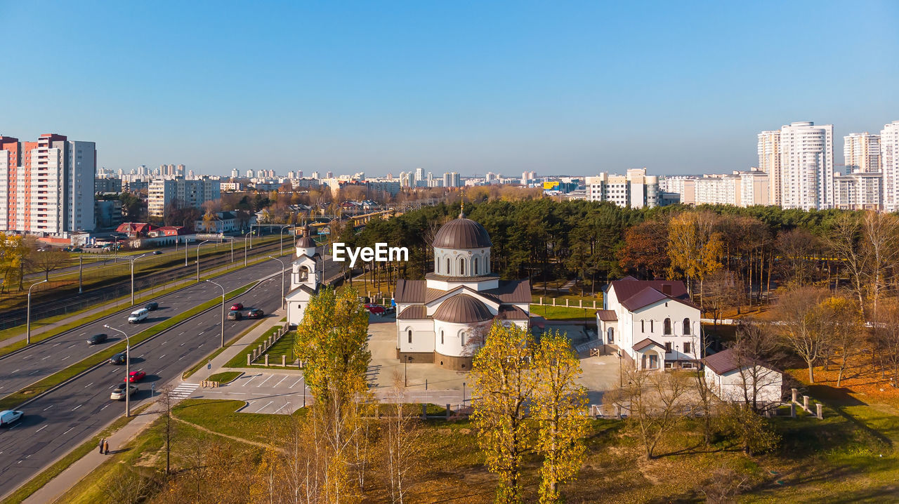 High angle view of buildings in city against clear sky